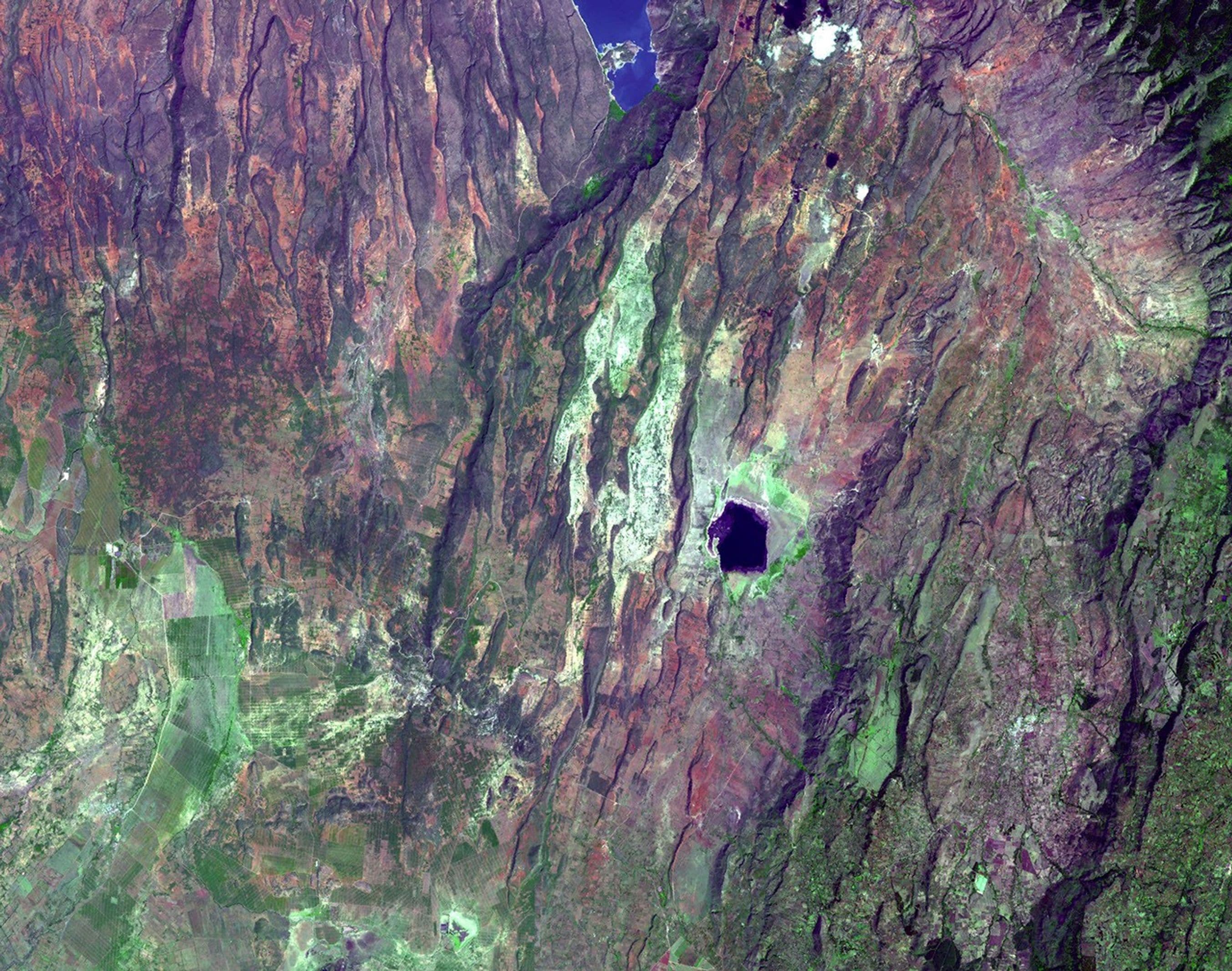 ASTER satellite image of the East African Rift near Lake Bogoria, showing fault scarps and rift lakes.