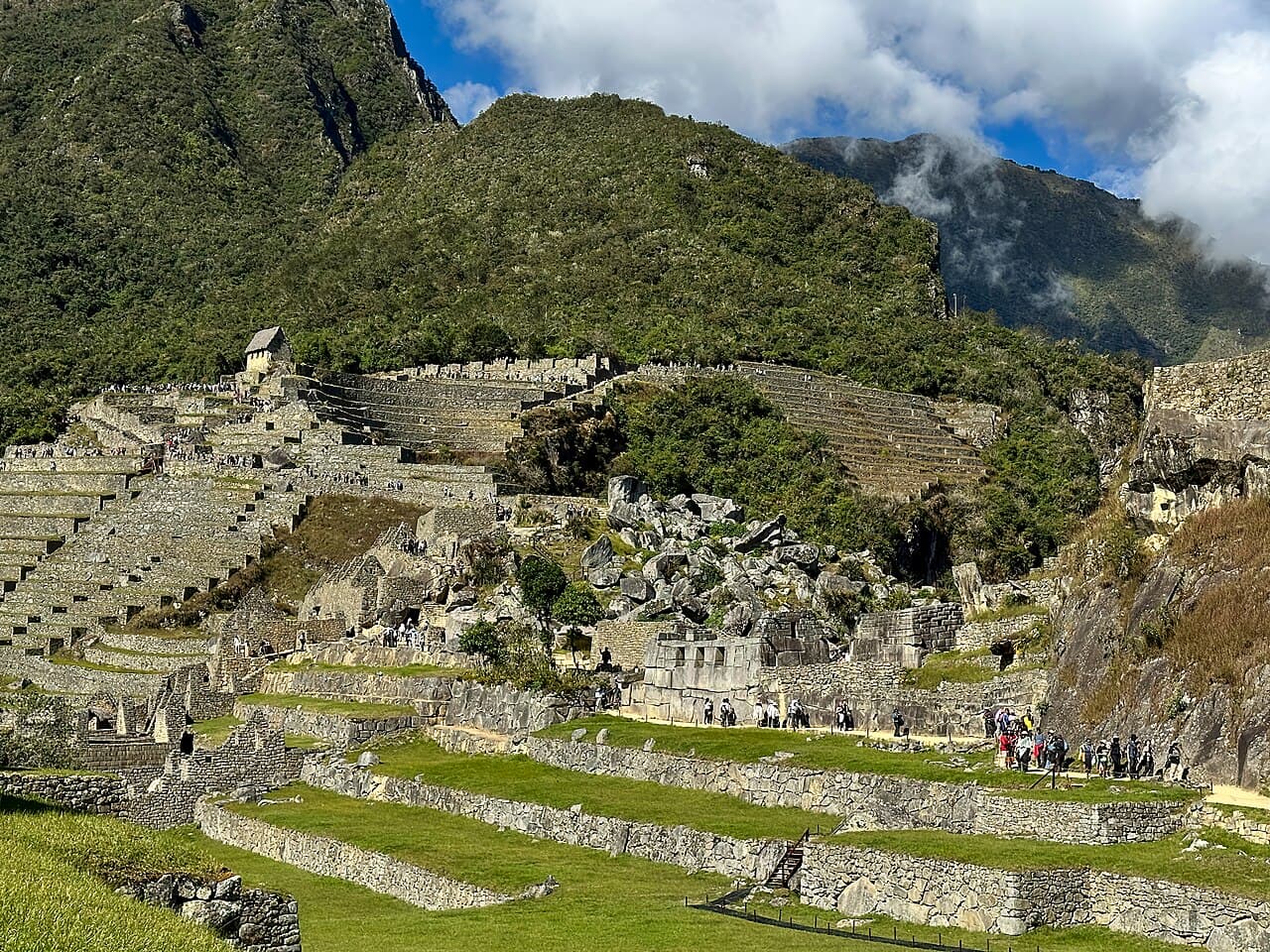 Machu Picchu rock quarry and terraces with broken granite blocks.