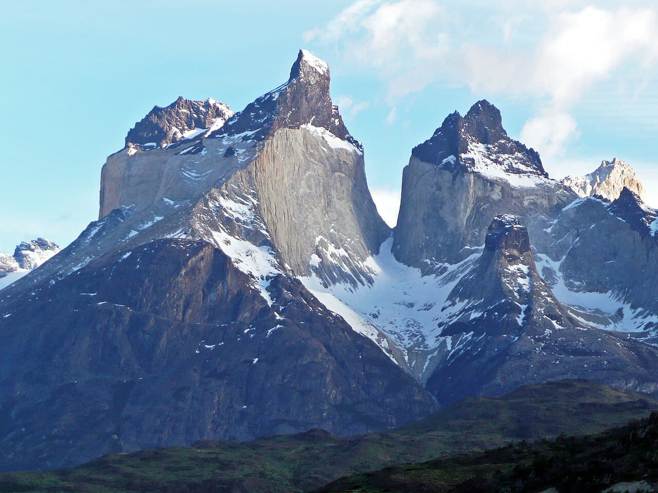 Cuernos del Paine showing a light granite laccolith intruded between darker sedimentary rocks.
