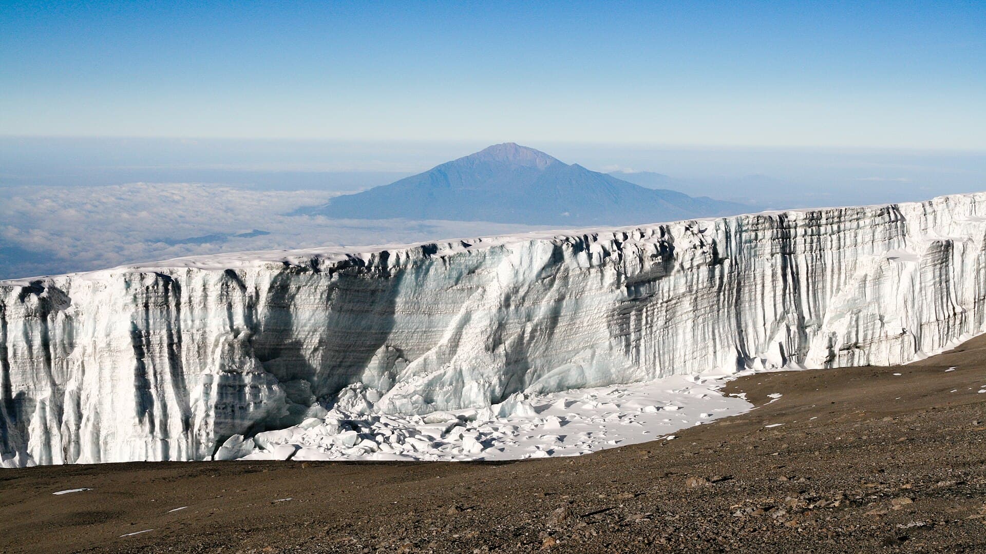 A summit glacier with Mount Meru behind